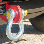 Bow shackle with yellow pin secured to 4WD rear recovery point.