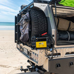 12V air compressor put on 4WD at the beach, with gauge and alligator clips for off-road tyre inflation.