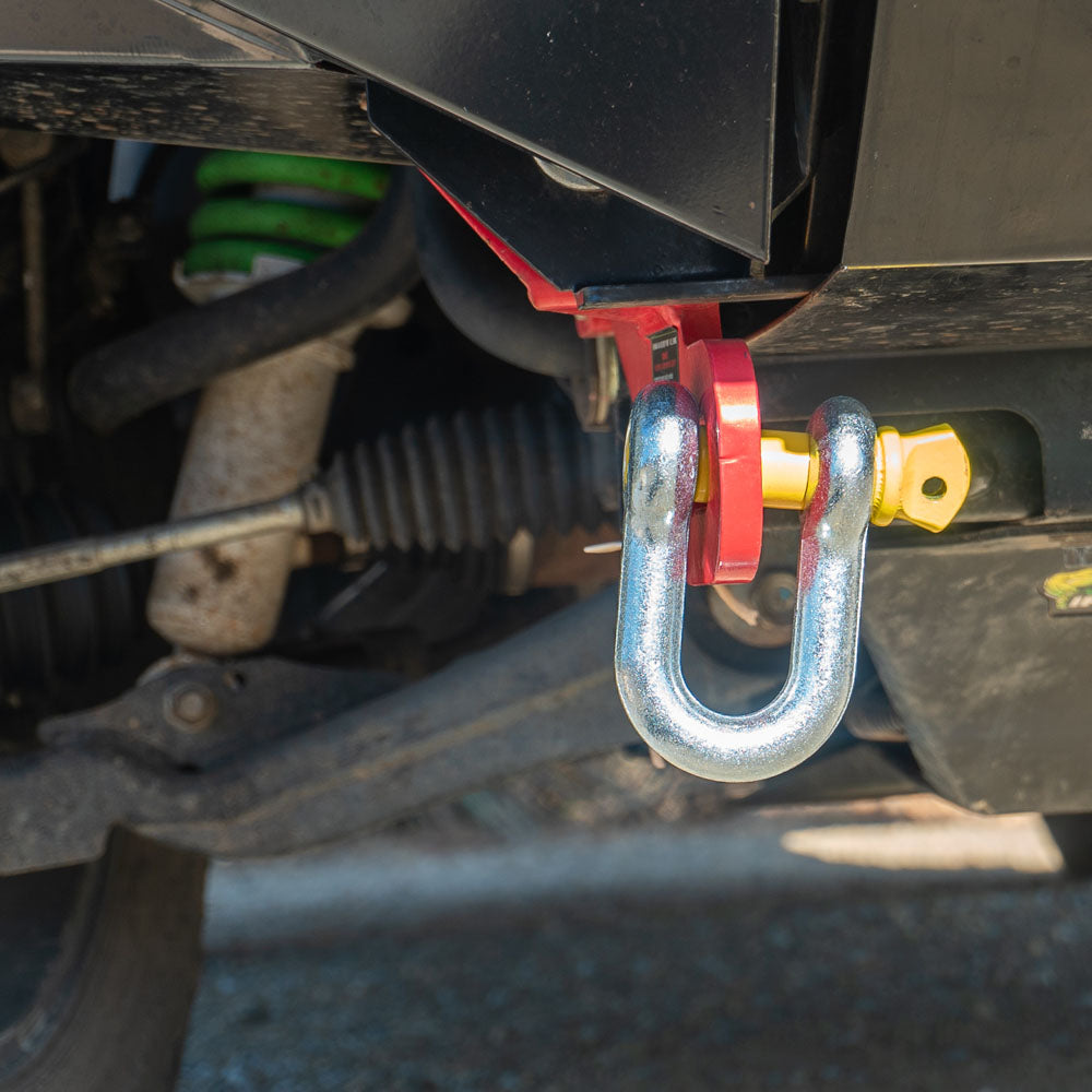D shackle with yellow pin secured to 4WD rear recovery point.