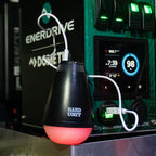 LED camping light with red glow connected to power system via USB, ideal for off-grid lighting and insect repellent use.