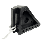 Small solid rubber wheel chock with side grip slot and pull rope for easy removal, ideal for trailers and caravans.