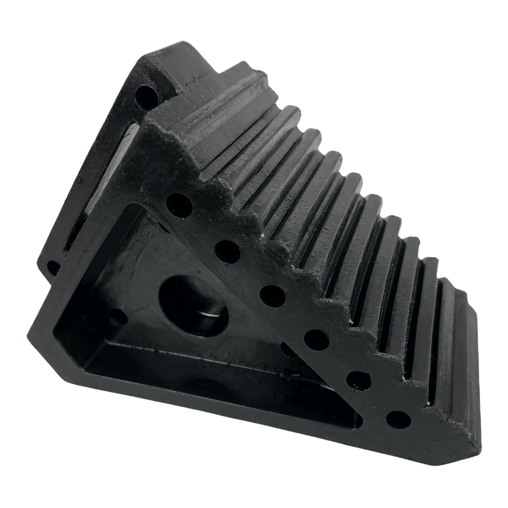 Small solid rubber wheel chock for trailers and caravans, with grooved surface for grip