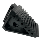 Small solid rubber wheel chock for trailers and caravans, with grooved surface for grip